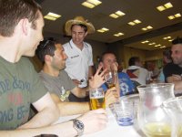 IMGP0763  Nico converses with a Grenoble player wearing a chapeau de paille and wielding a fork