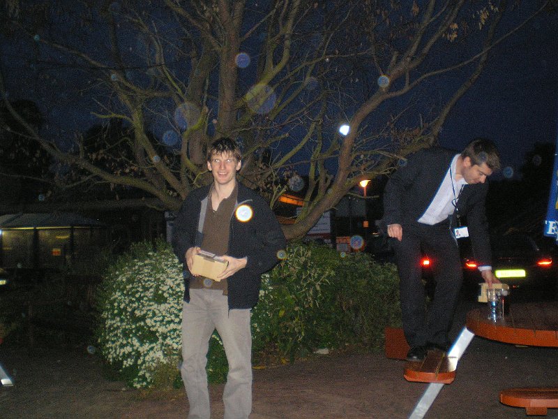 P5180019.jpg -  Jon receives his presentation after a decade of service while Ian balances precariously. 